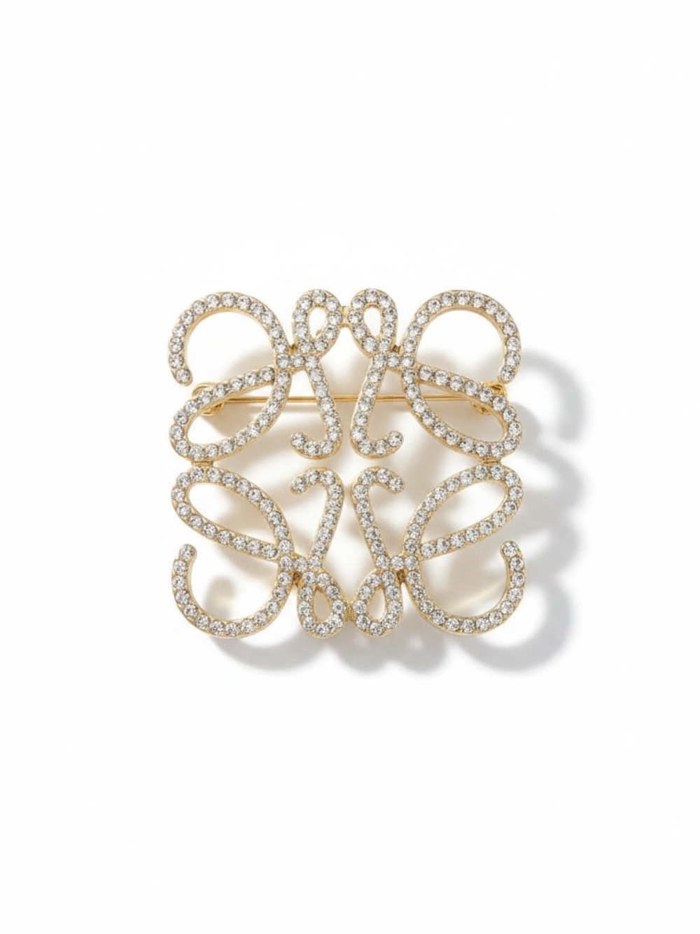 Luxury Loewe Anagram gold tone Brooch openwork design. New